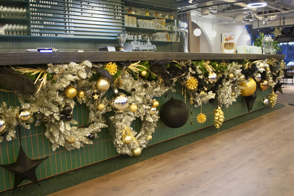 8. McCann 2022 Xmas Wide shot of bar with replica wreaths and garlands lr